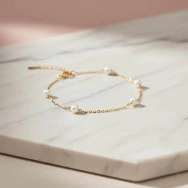 bransoletka z perłami na łańcuszku srebro pozłacane 925 lukier bransoletka z perłami regulowana srebro 925 pozłacane lukier jewellery, modna i stylowa